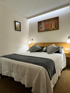 Postel nebo postele na pokoji v ubytování Nest Style Santiago