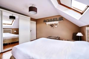 Letto o letti in una camera di Gîte des Crêtes