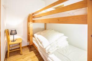 Postel nebo postele na pokoji v ubytování Le Pichu - Appt avec vue montagne