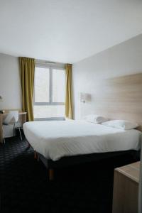 Postel nebo postele na pokoji v ubytování Hôtel d'Orsay