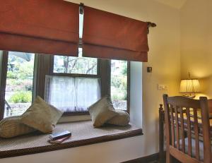 A bed or beds in a room at The Himalayan