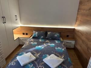 a small bedroom with a bed in a tiny house at Studio Lazur in Burgas +4 photos