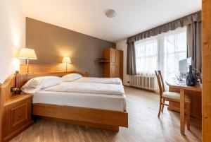 Postel nebo postele na pokoji v ubytování WHITE MOSS GARNì