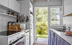 a kitchen with a sink and a counter top at 2 Bedroom Nice Home In Samsø in Samsø