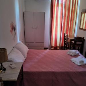 Postel nebo postele na pokoji v ubytování Ξενοδοχείο 'ΠΑΛΛΑΔΙΟΝ' Hotel 'PALLADION'