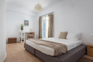 Postel nebo postele na pokoji v ubytování Bougainvillea Comfort Villa Mykonos