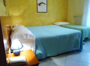 Postel nebo postele na pokoji v ubytování Hotel Miramonti