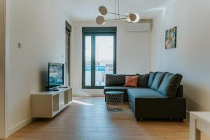 Un televizor și/sau centru de divertisment la Apartmani Laketić