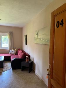 a living room with a couch and a table at Sunrise house apartments in Ulcinj