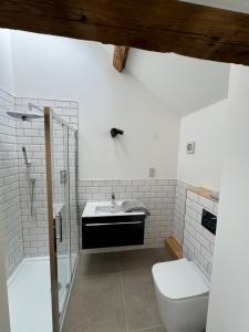 a bathroom with a sink and a toilet at Threshing Barn- Modern 5 Bed, 10 person, Barn Conversion in a Rural Location with Great Access in Silkstone +32 photos