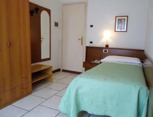 Postel nebo postele na pokoji v ubytování Hotel Miramonti