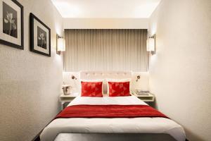 Postel nebo postele na pokoji v ubytování Hotel Astoria