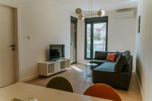 Un televizor și/sau centru de divertisment la Apartmani Laketić