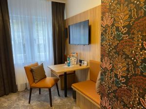 TV a/nebo společenská místnost v ubytování Akzent Hotel Schranne