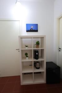 TV a/nebo společenská místnost v ubytování Il Quadrifoglio B&B