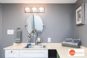 a bathroom with a sink and a mirror at 1 Happy Acre in Holland +23 photos