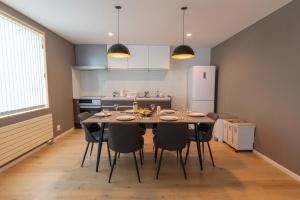 a kitchen with a dining room table and chairs at Snow Monkey Loft in Kutchan