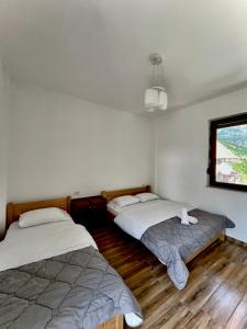 Postel nebo postele na pokoji v ubytování LAZER ÇARDAKU Guesthouse