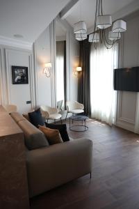 a living room with a couch and chairs at Apartments in the heart of Cannes in Cannes