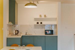 O bucătărie sau chicinetă la Apartmani Laketić