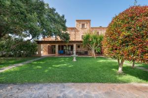 an exterior view of a house with a yard at NEW!Villa SESPIGA in Portocolom