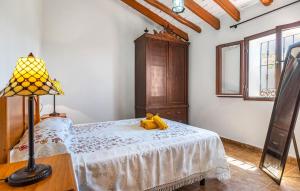a bedroom with a bed with a lamp on it at Lovely Home In Torrox in Torrox