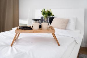 Postel nebo postele na pokoji v ubytování Łódź Manufaktura - Balcony & Workspace by Rentujemy + 11 fotografií