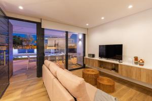 TV a/nebo společenská místnost v ubytování Luxurious & Comfy by Fidalsa