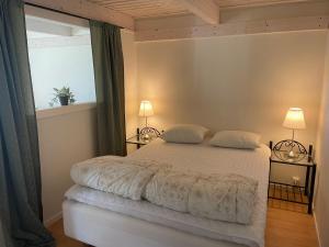 Postel nebo postele na pokoji v ubytování Kapelludden Östra Öland