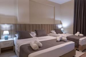 Postel nebo postele na pokoji v ubytování Altobelo Hotel