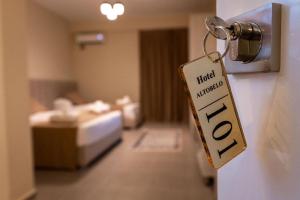 Postel nebo postele na pokoji v ubytování Altobelo Hotel