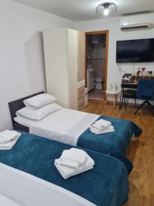 Posteľ alebo postele v izbe v ubytovaní INCHY ACCOMMODATION - in the center of Diocletian's Palace