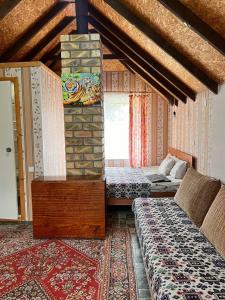 Postel nebo postele na pokoji v ubytování Podsolnukhi Guest House + 27 fotografií