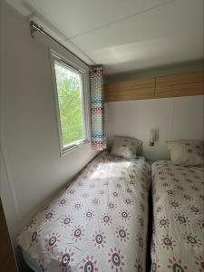 Camping La Tuque客房内的一张或多张床位