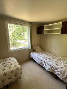 Camping La Tuque客房内的一张或多张床位