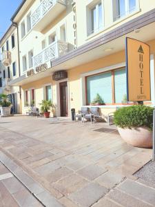 a building with a patio in front of it at Hotel Giotto in Padova