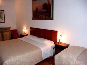 Postel nebo postele na pokoji v ubytování Albergo San Giovanni
