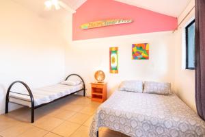 Postel nebo postele na pokoji v ubytování Wipeout Hostel