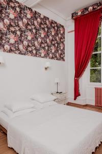 Postel nebo postele na pokoji v ubytování Hotel Moderne Et Pigeon