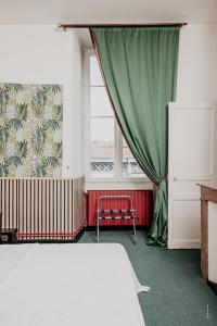 Postel nebo postele na pokoji v ubytování Hotel Moderne Et Pigeon