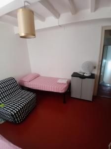 San Lorenzo Apartment tesisinde bir odada yatak veya yataklar