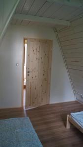 Letto o letti in una camera di Domek nad Jeziorem Kaszuby max 6 os