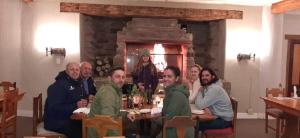 a group of people sitting at a table at Blanco Guest Farm - Holiday Resort in Tarkastad