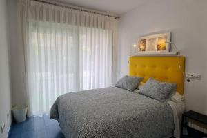 Ένα ή περισσότερα κρεβάτια σε δωμάτιο στο Apartamento tranquilo Altorreal con WiFi
