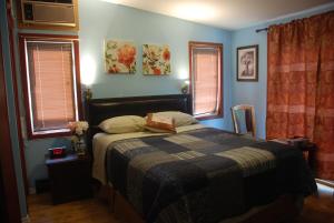 Säng eller sängar i ett rum på Ambassador B&B Guest Home