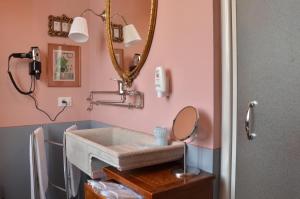a bathroom with a sink and a mirror at Azienda Agricola La Botanica in Lentate sul Seveso +32 photos