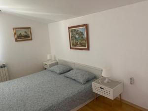 Postel nebo postele na pokoji v ubytování Apartments Lav