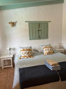 Ένα ή περισσότερα κρεβάτια σε δωμάτιο στο Cortijo Vacas Gordas B&B