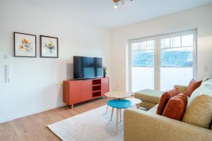 TV a/nebo společenská místnost v ubytování Apartment am Deich 01