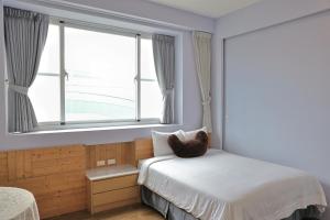 Кровать или кровати в номере Ding Dong Homestay